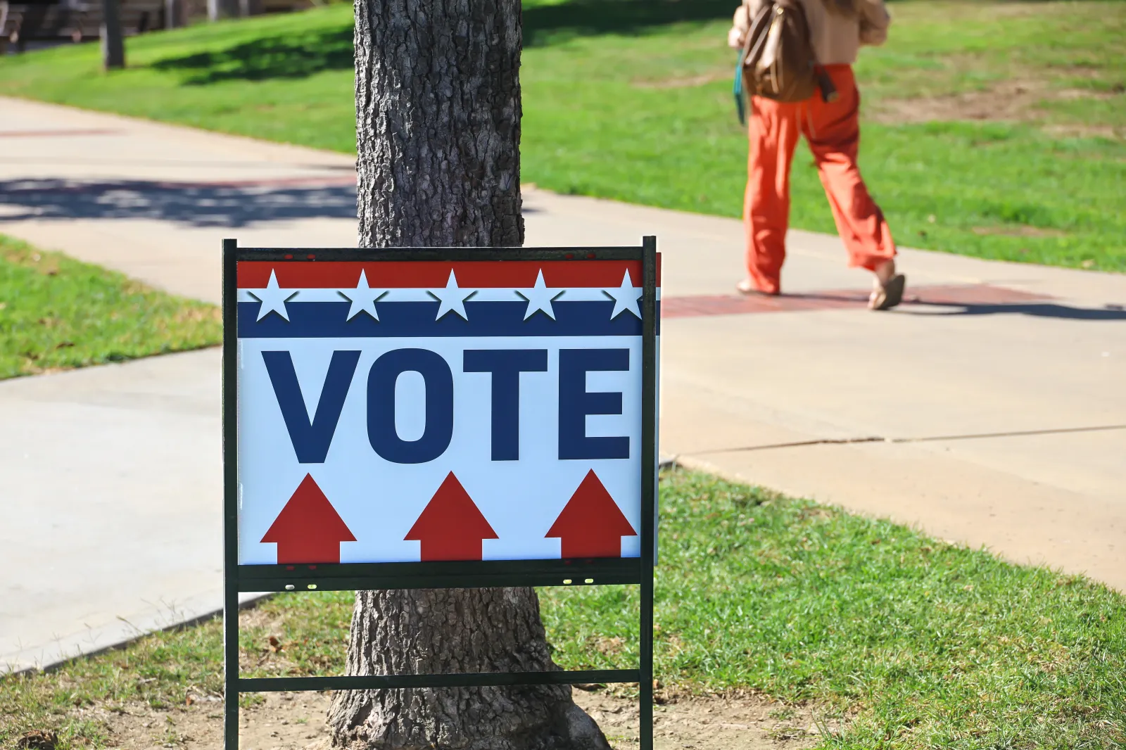 A sign indicates where to go to vote at the Ventura County Government Center in Ventura, California, on October 22, 2024.