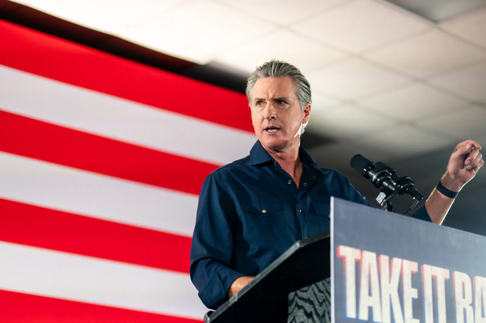 Gavin Newsom gestures as he speaks during the World Economic Forum (WEF) and U.S. Vice President JD Vance in Minnesota amid a surge of ICE activity