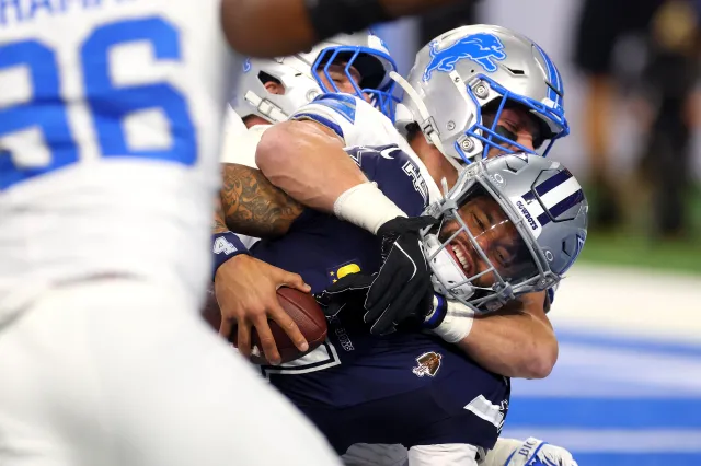 Jack Campbell #46 of the Detroit Lions sacks Dak Prescott #4 of the Dallas Cowboys