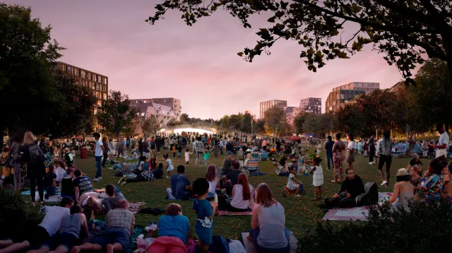 Rendering of people enjoying an community event in a large proposed open space at YZD