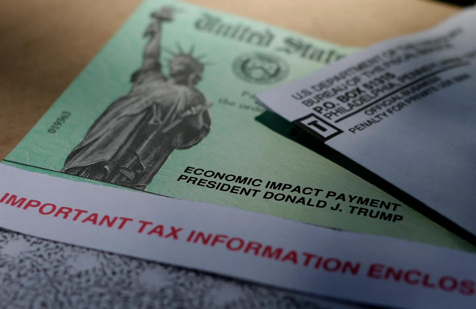 In this file photo from April 23, 2020, President Donald Trump's name is shown printed on a stimulus check issued by the IRS to help combat the adverse economic effects of the COVID-19 outbreak. (AP Photo/Eric Gay)