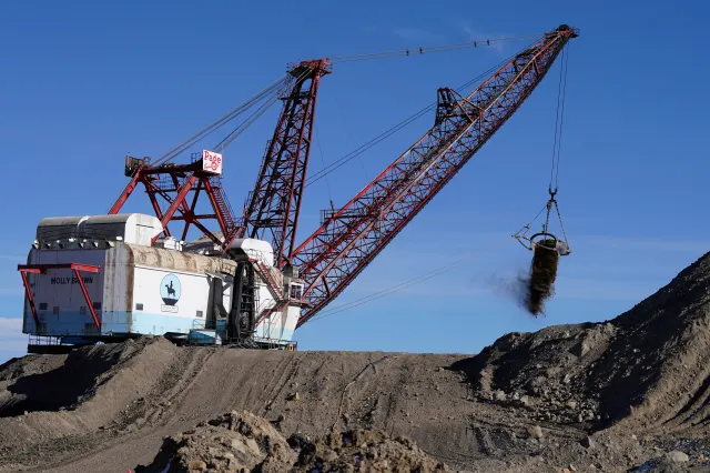 A dragline excavator moves the rock or soil layer that needs to be removed in order to access the coal at Trapper Mining in 2021, in Craig, Colorado.