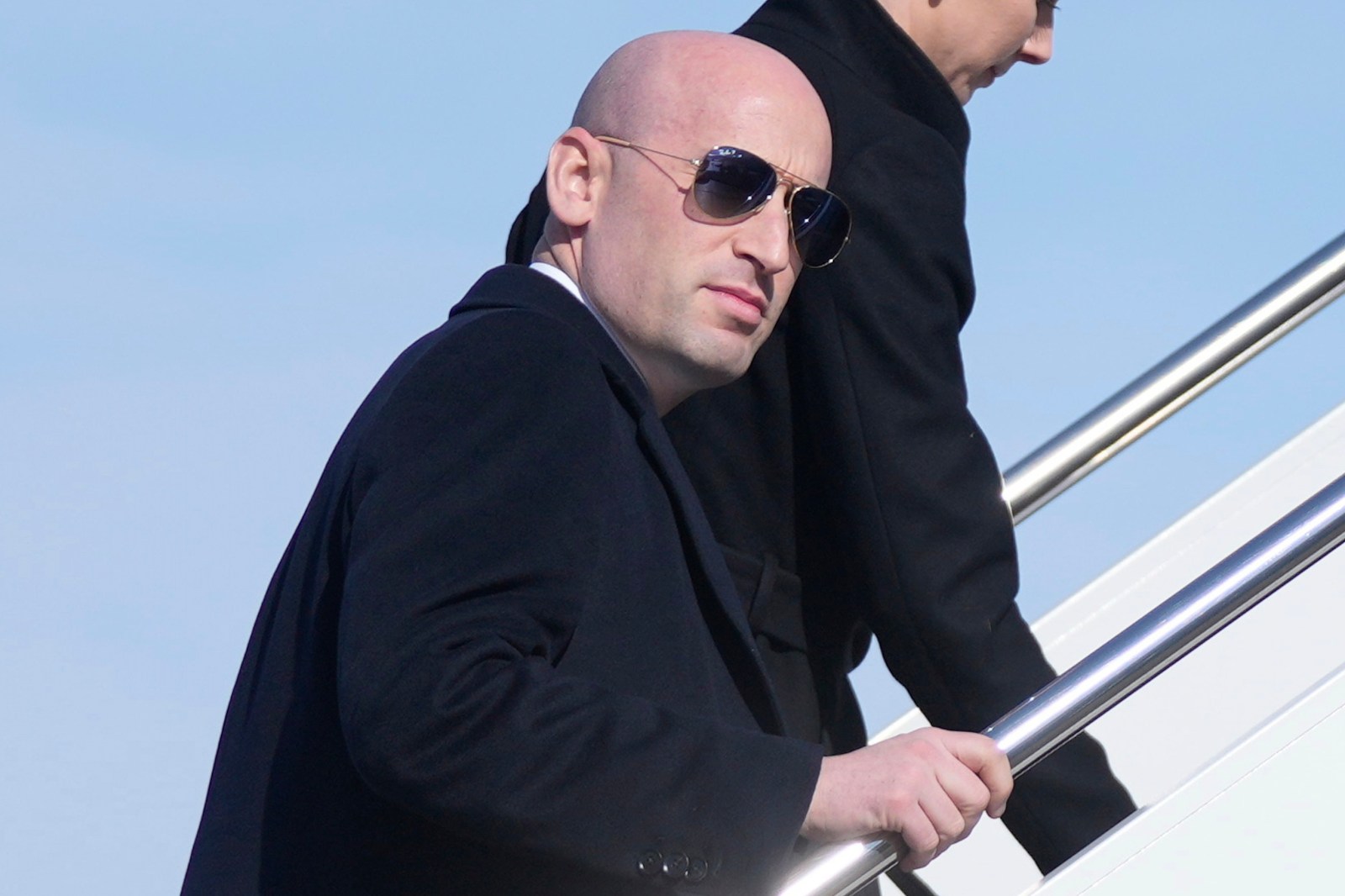 White House deputy chief of staff Stephen Miller boards Air Force One, Tuesday, Jan. 27, 2026, at Joint Base Andrews, Md., for a trip to Iowa. (AP Photo/Mark Schiefelbein)
