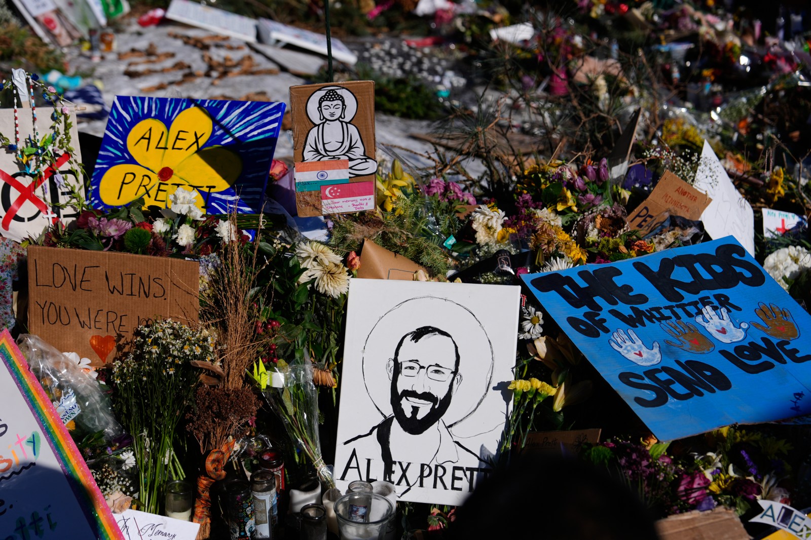 A drawing of Alex Pretti is displayed at the scene where 37-year-old Pretti was fatally shot by a U.S. Border Patrol officer over the weekend, Tuesday, Jan. 27, 2026, in Minneapolis. (AP Photo/Julia Demaree Nikhinson)
