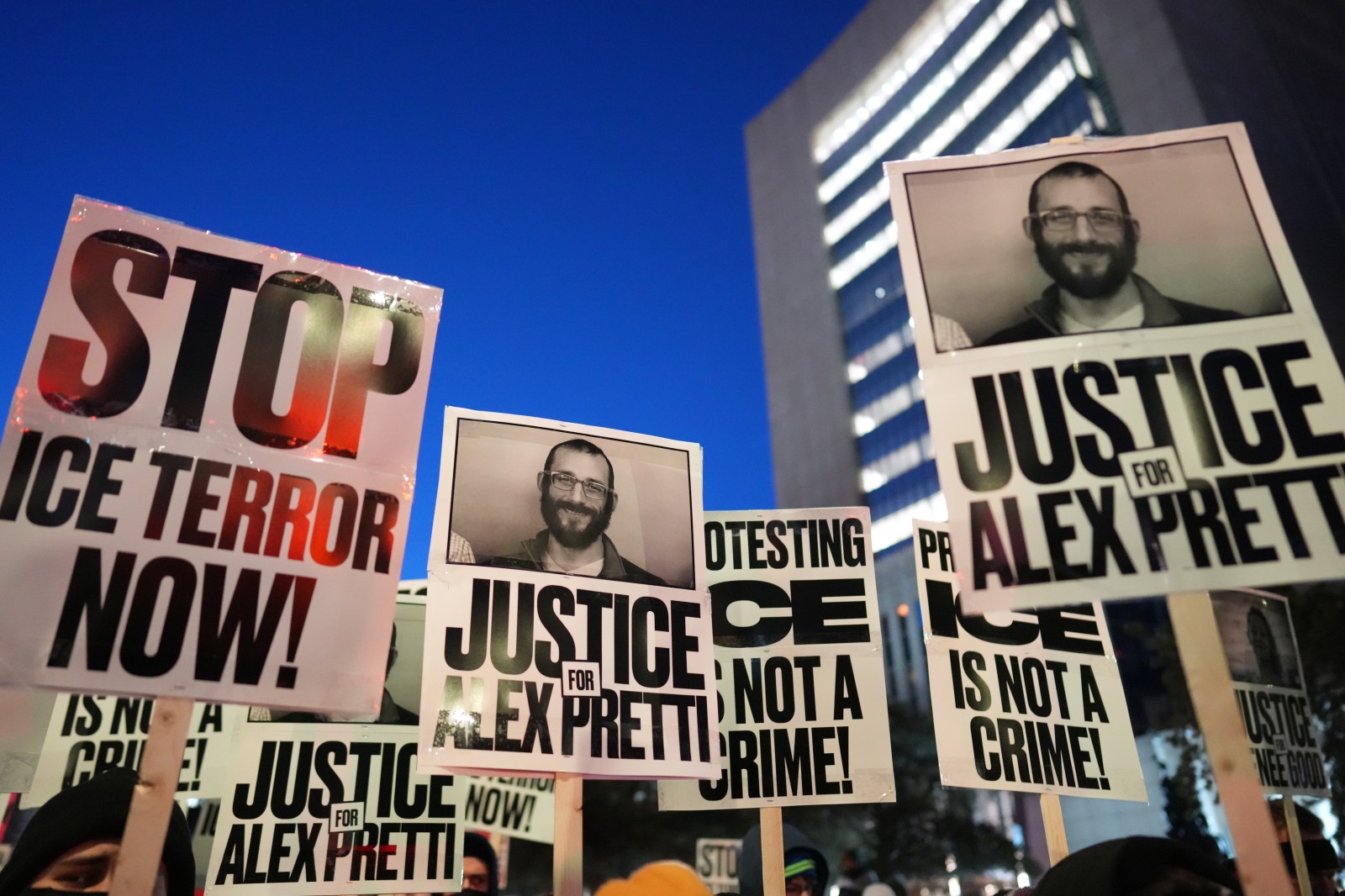 Demonstrators hold signs during a rally against federal immigration enforcement at Federal Courthouse Plaza on Tuesday, January 27, 2026, in Minneapolis.

