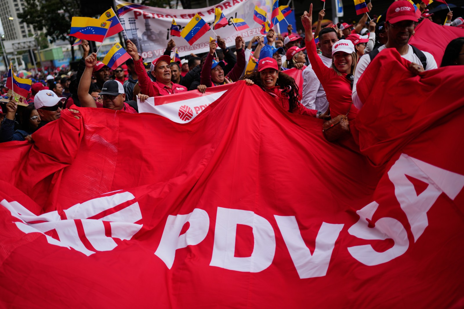 Workers of Venezuela’s state-owned PDVSA oil company rally to back an oil reform bill proposed by acting President Delcy Rodriguez to loosen state control and open the industry to private and foreign investment in Caracas, Venezuela, Thursday, Jan. 29, 2026. (AP Photo/Ariana Cubillos)
