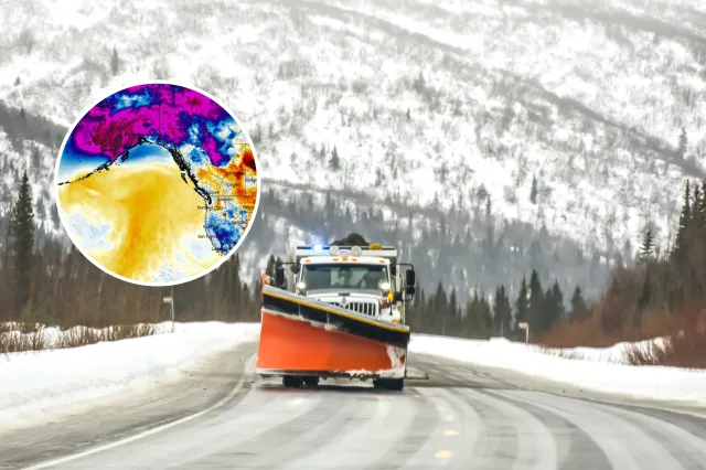 A snow plow makes it way down the highway - stock image