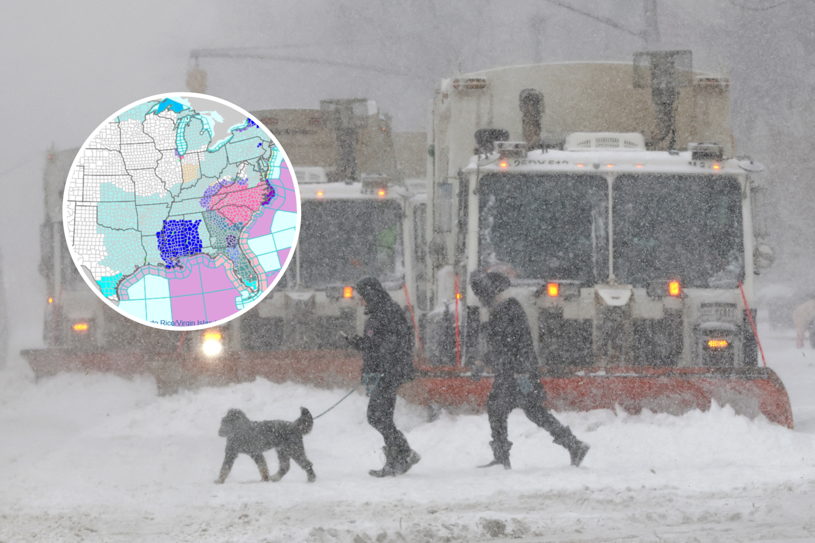 People cross a street as trucks plow snow in the Manhattan borough of New York City on January 25, 2026
