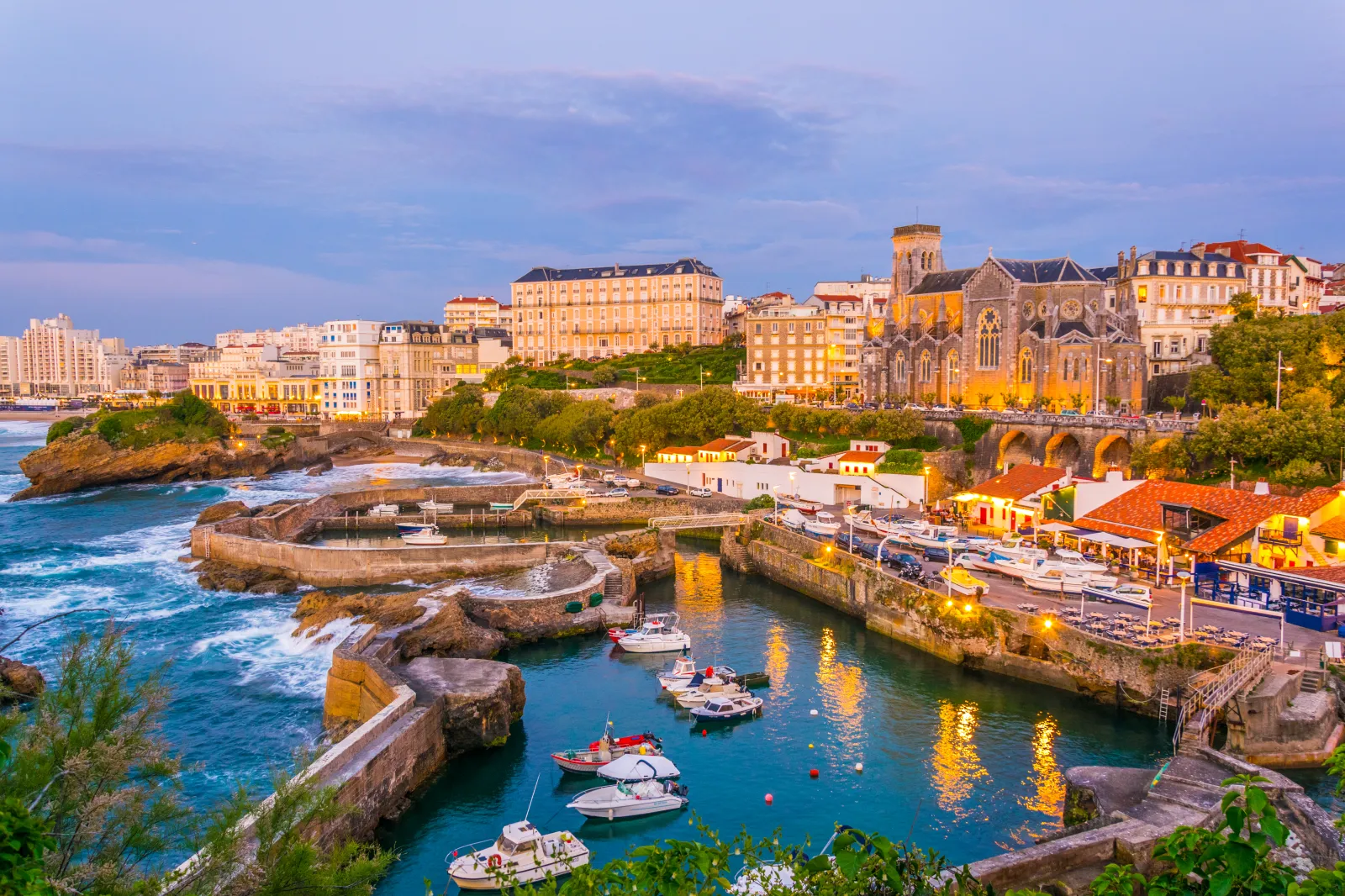 An image of a sunset view of a marina in Biarritz, France.