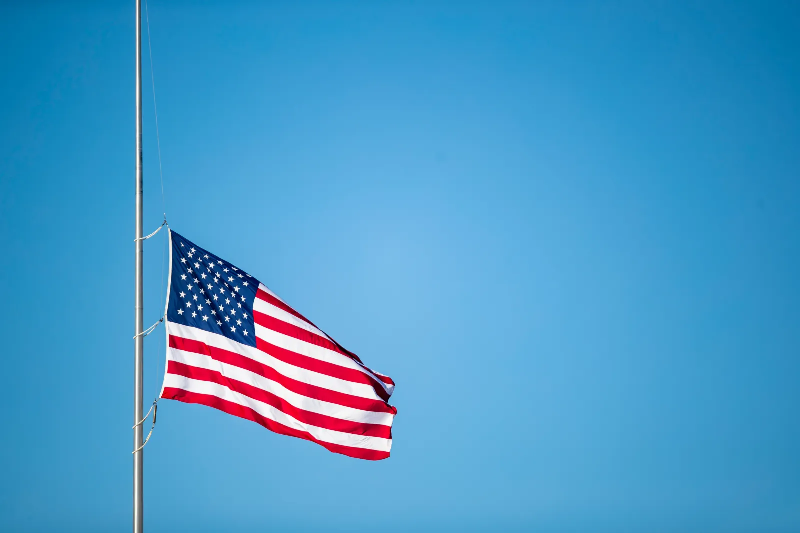 File Image: American flag flies at half staff