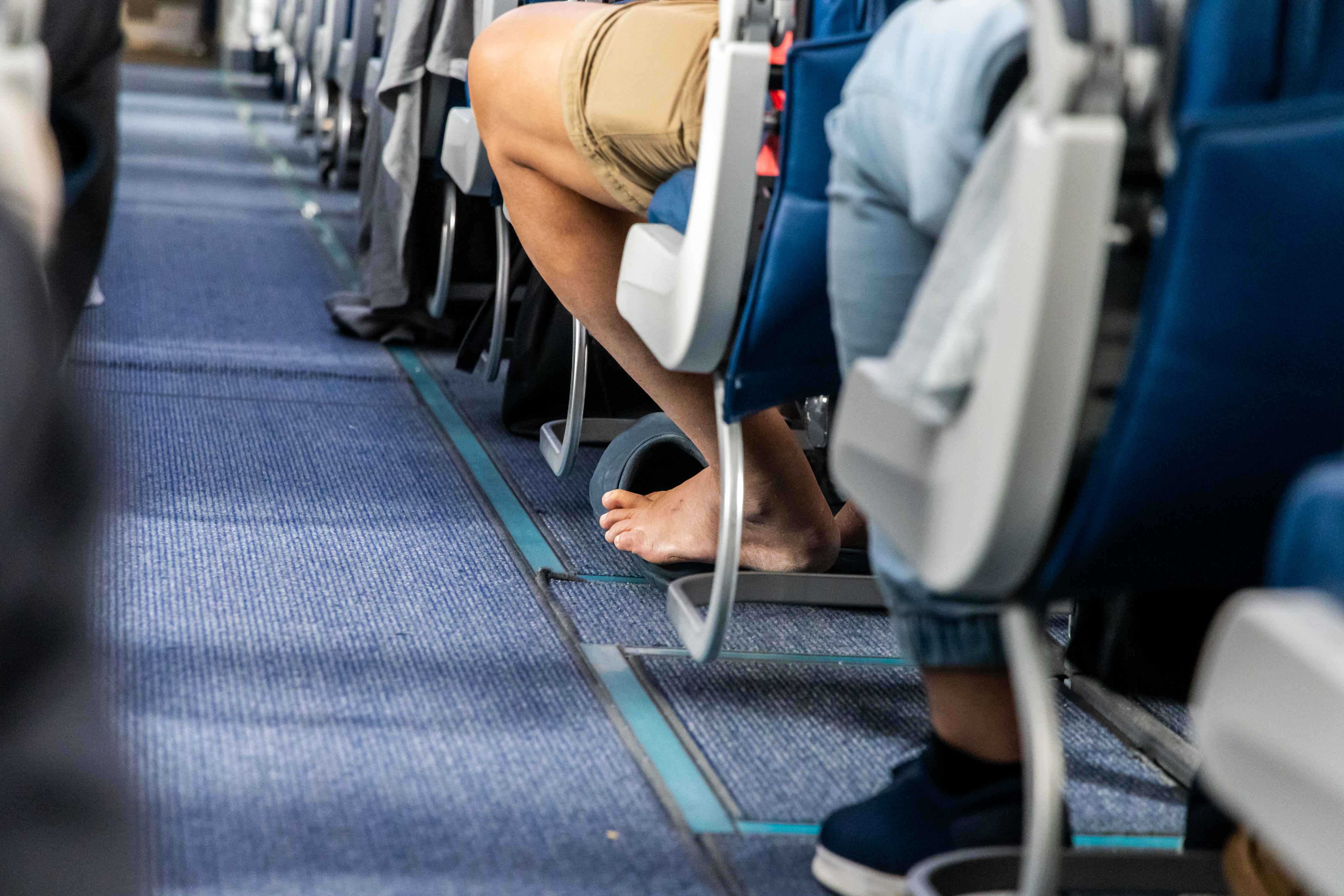 Plane Passenger Slams Woman for How She Sits in Seat, Internet Left Stunned