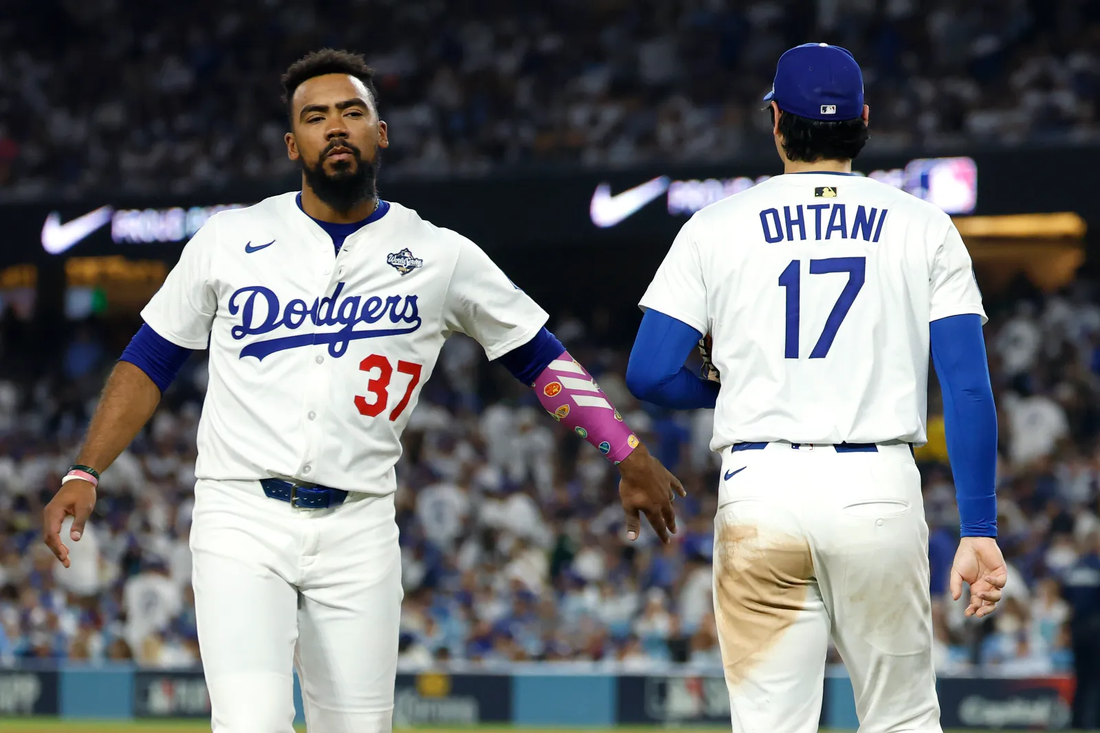 LOS ANGELES, CALIFORNIA - OCTOBER 28: Teoscar Hernández #37 of the Los Angeles Dodgers reacts as Shohei Ohtani #17 takes the mound in the seventh inning against the Toronto Blue Jays in game four of the 2025 World Series at Dodger Stadium on October 28, 2025 in Los Angeles, California. (Photo by Harry How/Getty Images)
