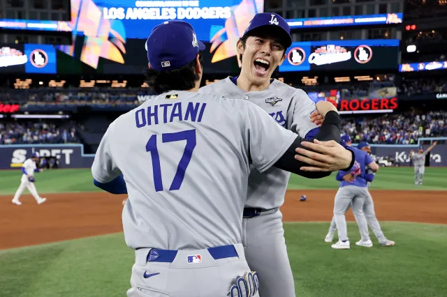 TORONTO, ONTARIO - NOVEMBER 02: Roki Sasaki #11 and Shohei Ohtani #17 of the Los Angeles Dodgers celebrate after defeating the Toronto Blue Jays 5-4 in game seven of the 2025 World Series at Rogers Center on November 02, 2025 in Toronto, Ontario. (Photo by Emilee Chinn/Getty Images)