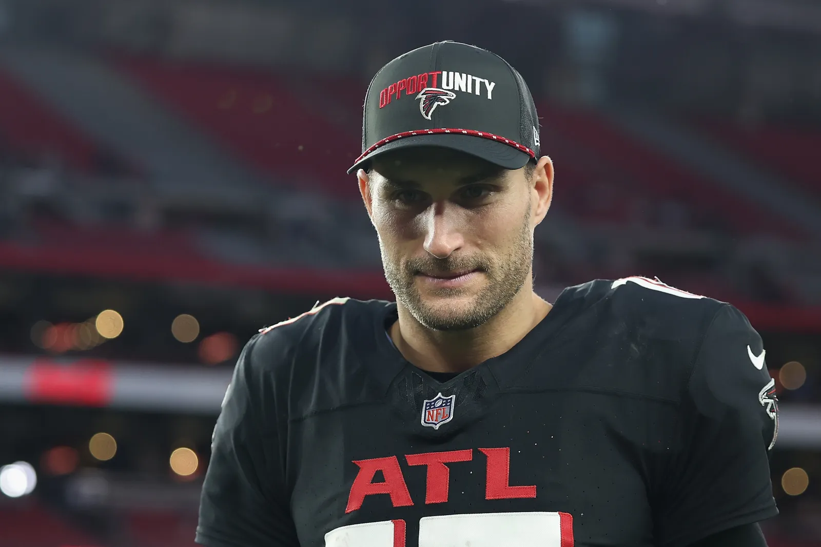 Kirk Cousins #18 of the Atlanta Falcons walks off the field during the NFL game at State Farm Stadium on December 21, 2025 in Glendale, Arizona. The Falcons defeated the Cardinals 26-19.