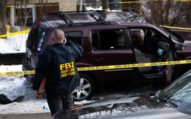 Members of law enforcement work the scene following a suspected shooting by an ICE agent during federal law enforcement operations on January 07, 2026 in Minneapolis, Minnesota