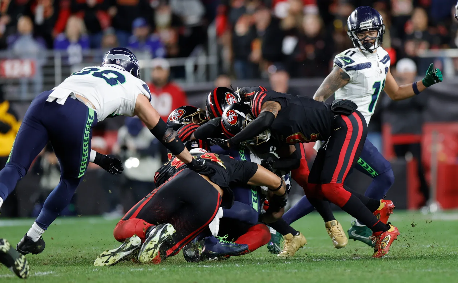 The San Francisco 49ers tackle Kenneth Walker III of the Seattle Seahawks during the game at Levi's Stadium on January 3, 2026 in Santa Clara, California. The Seahawks defeated the 49ers 13-3.