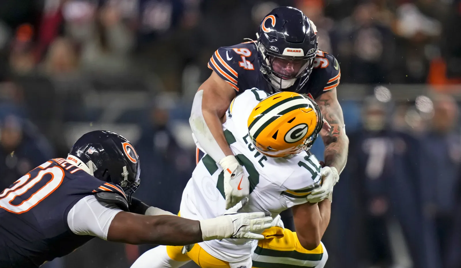 Chicago Bears DE Austin Booker and Green Bay Packers QB Jordan Love