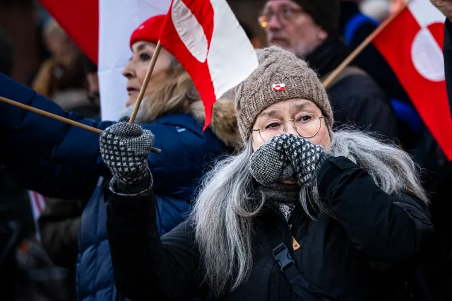 Protesters with Greenland flags gather for a protest titled Greenland Belongs to the Greenlanders outside the United States embassy on January 14, 2026 in Copenhagen, Denmark.
