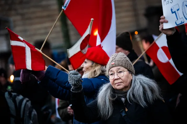 Protesters with Greenland flags gather for a protest titled Greenland Belongs to the Greenlanders outside the United States embassy on January 14, 2026 in Copenhagen, Denmark