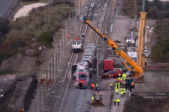 Emergency services and investigators work on the site of a high-speed trains collision that killed at least 42 people, in Adamuz, southern Spain, on January 20, 2026