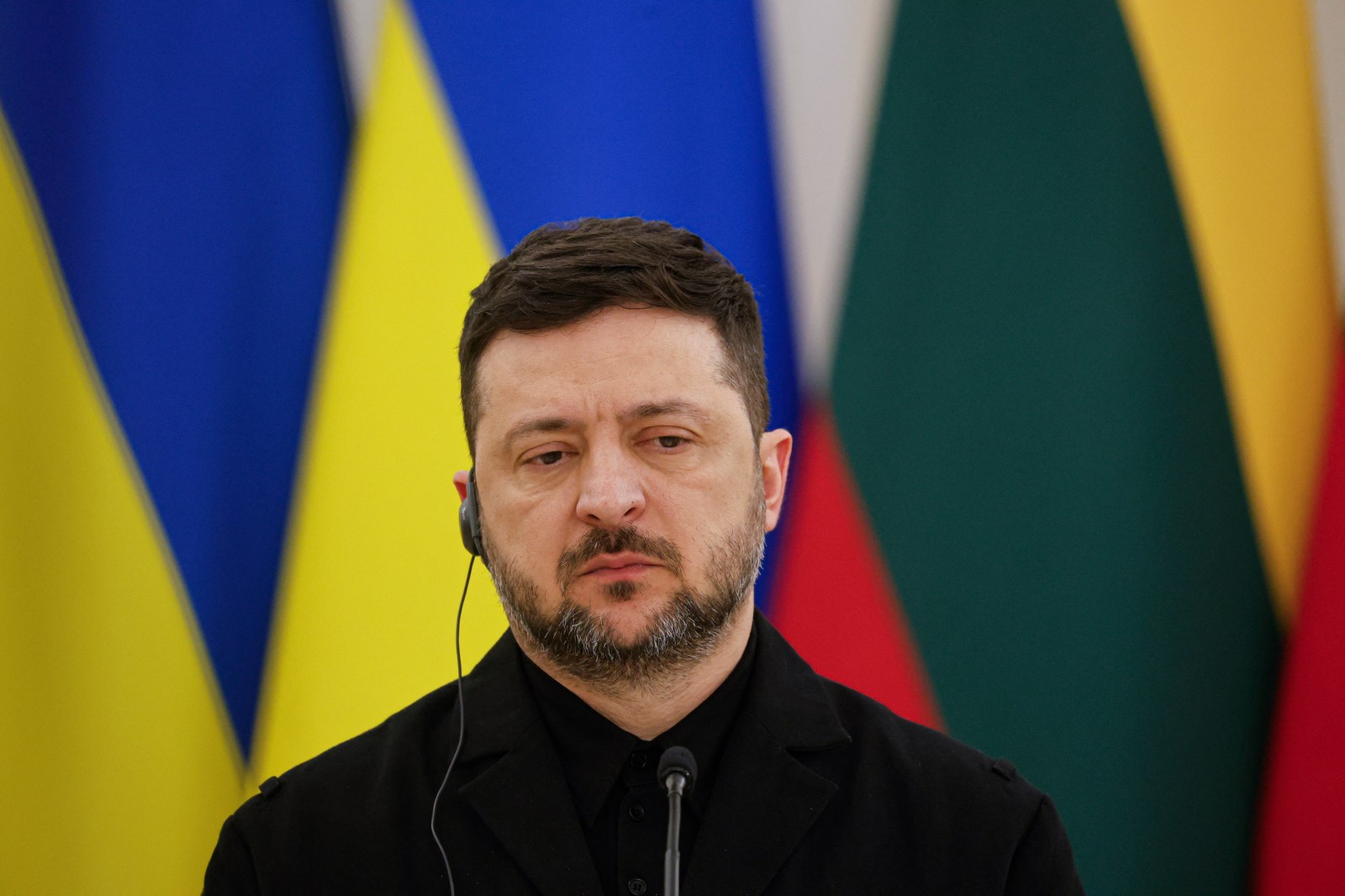 Ukraine’s President Volodymyr Zelensky looks on during a joint press conference with Lithuania’s President and Poland’s President, after attending commemorations of the 1863 uprising, in Vilnius on January 25, 2026.

