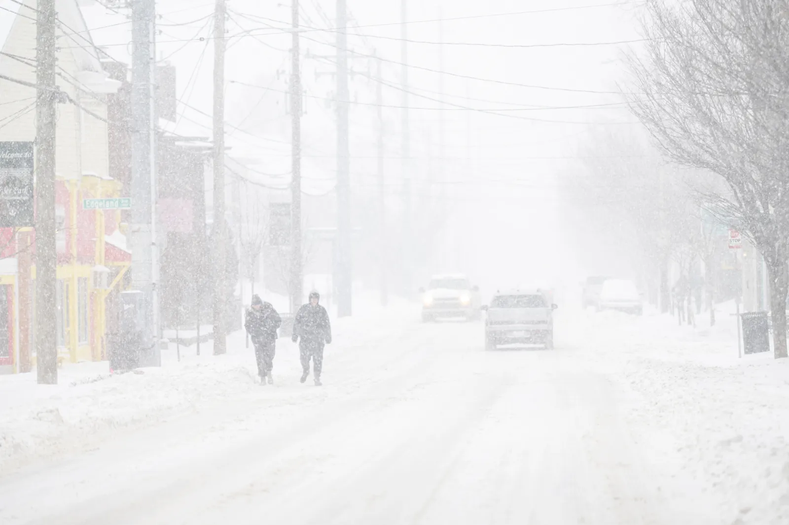 People walk the streets in near whiteout conditions on January 25, 2026 in Louisville, Kentucky.