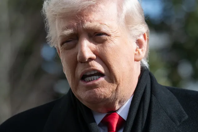 US President Donald Trump speaks to the media as he walks to Marine One prior to departure from the South Lawn of the White House in Washington, DC, January 27, 2026, as he travels to Iowa.