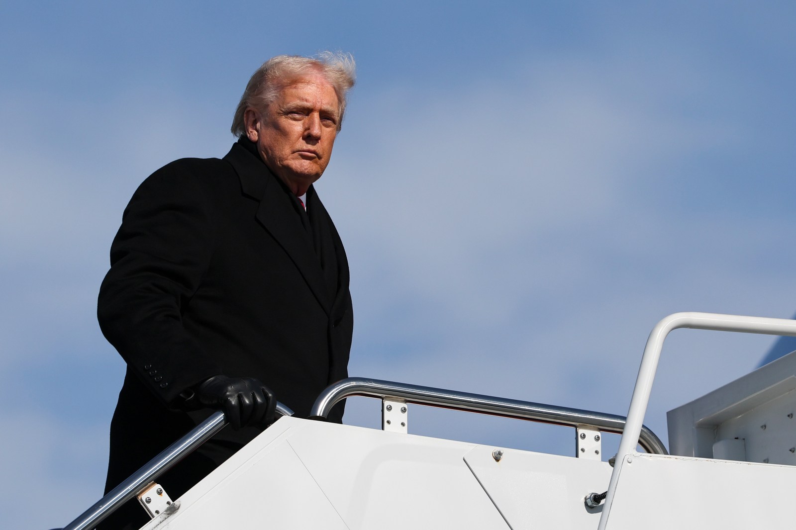 U.S. President Donald Trump boards Air Force One on January 27, 2026 at Joint Base Andrews, Maryland.
