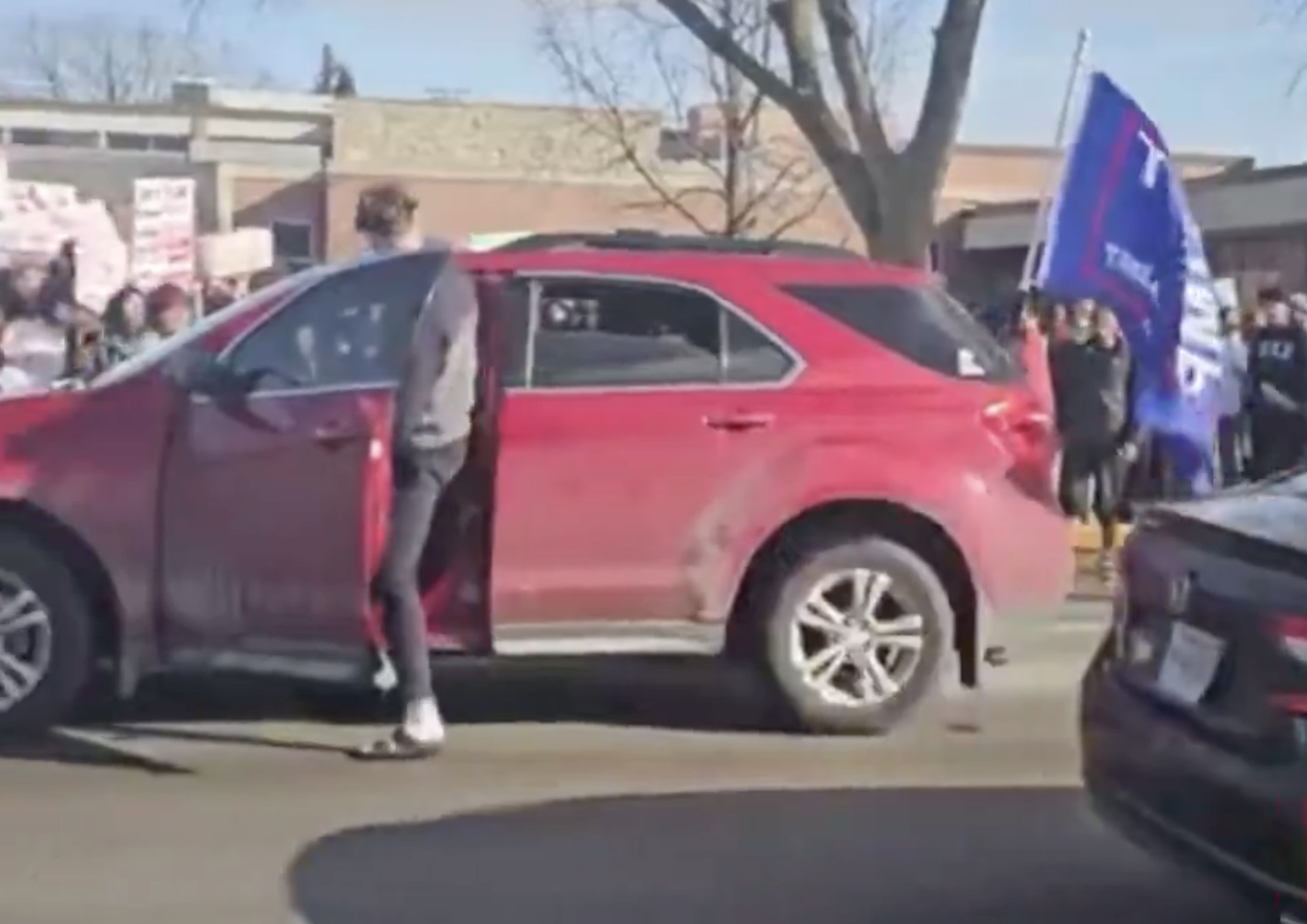 Schoolgirl at ICE Protest Struck by Car With Trump Flag