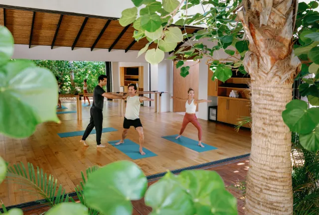 Two people practicing yoga at Sensei at Zadún Los Cabos, A Ritz-Carlton Reserve