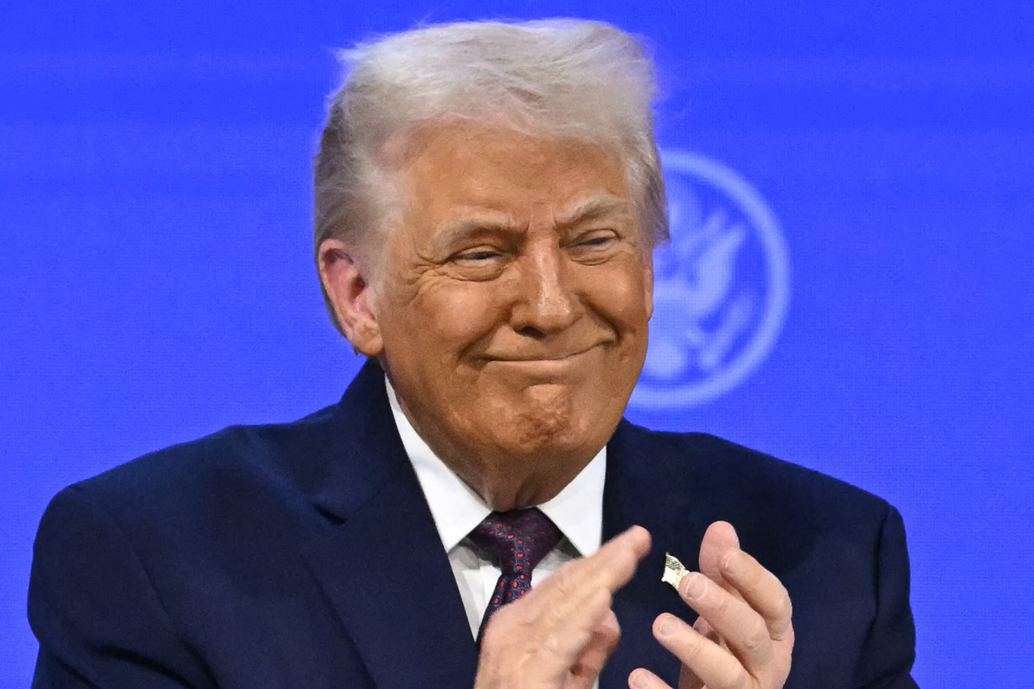 President Donald Trump gestures as he speaks at the “Board of Peace” meeting during the World Economic Forum (WEF).
