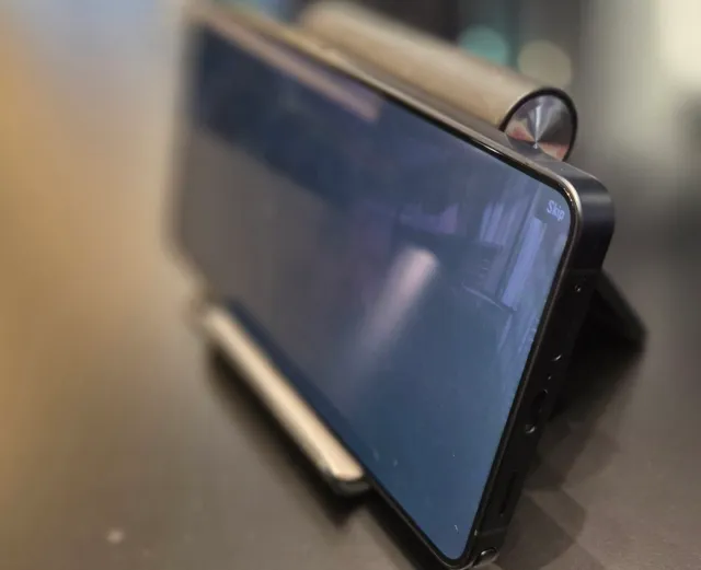 A phone viewed from the side with a dark screen
