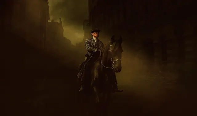 A man riding a horse through shadowy streets