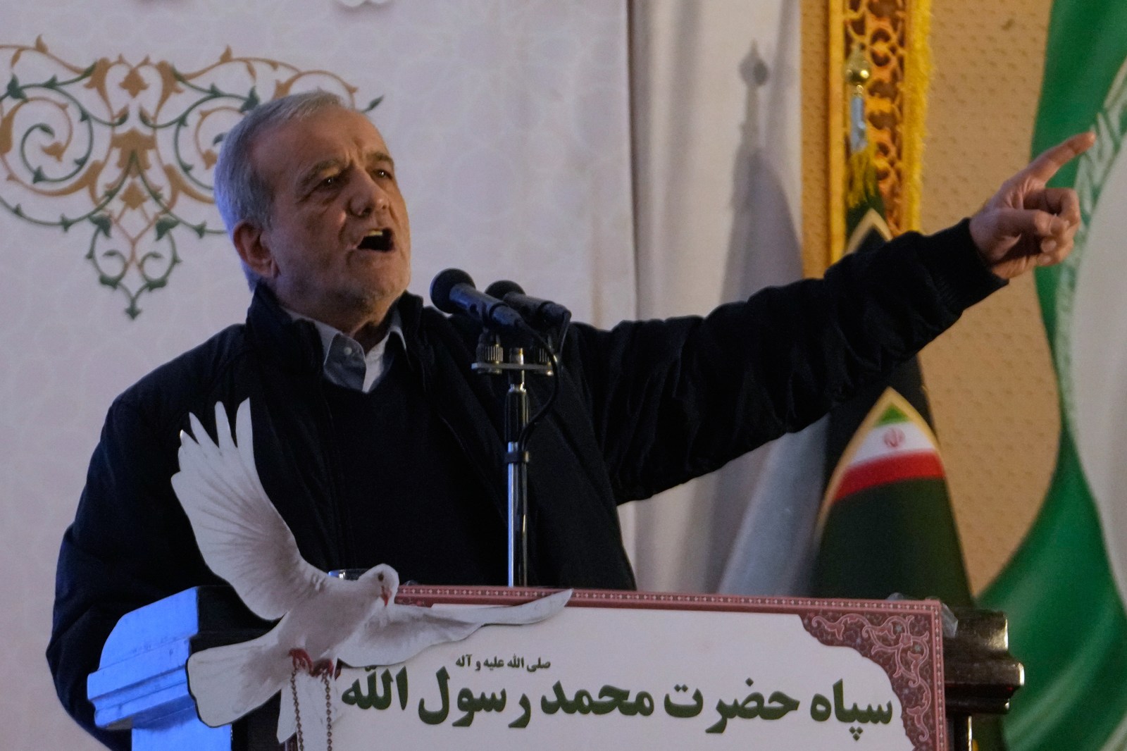 Iranian President Masoud Pezeshkian speaks during a ceremony commemorating the death anniversary of the late commander of the Iran’s Revolutionary Guard expeditionary Quds Force, Gen. Qassem Soleimani, who was killed in a U.S. drone attack in 2020 in Iraq, at the Imam Khomeini grand mosque in Tehran, Iran, Thursday, Jan. 1, 2026. (AP Photo/Vahid Salemi)