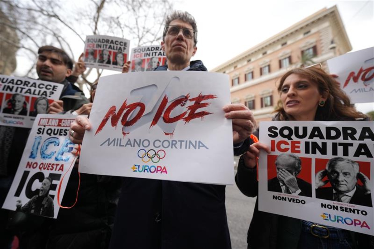 Italian Lawmaker Riccardo Magi, center, shows a placard demanding that Immigration and Customs Enforcement (ICE) agents not be allowed at the Milan Cortina Olympics during a protest staged by center-left party +Europa outside the US Embassy in Rome, Thursday, Jan. 29, 2026. 
