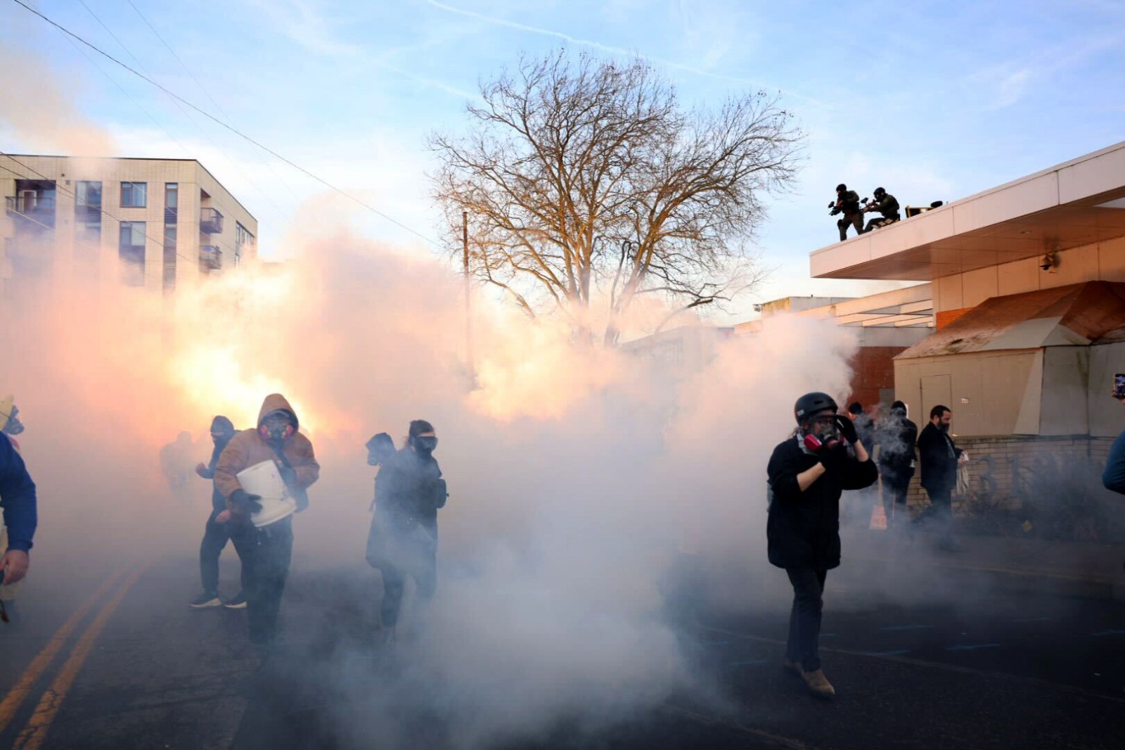 Federal agents lobbed tear gas and flash bangs at protesters in front of the ICE building on Jan. 31, 2026, in Portland, Oregan.

