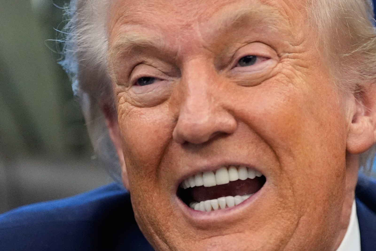 President Donald Trump speaks to reporters after signing a spending bill that ends a partial shutdown of the federal government in the Oval Office of the White House, Tuesday, Feb. 3, 2026, in Washington. (AP Photo/Alex Brandon)
