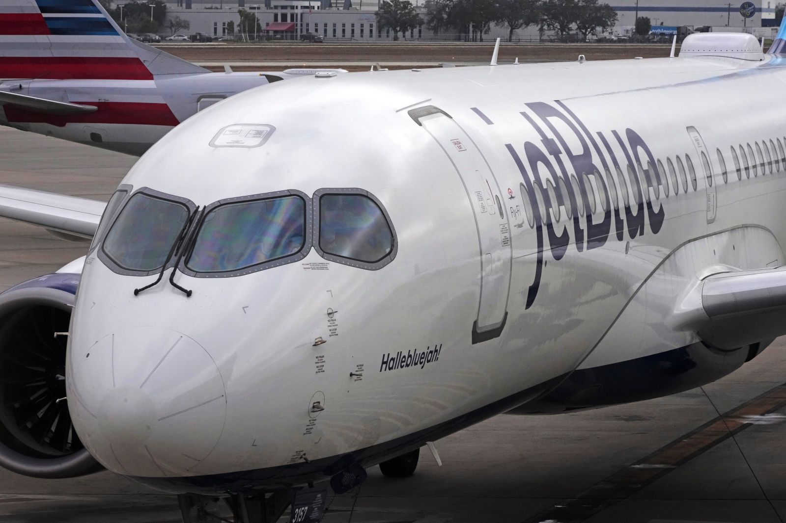 A Jet Blue Airlines jet is pushed back from a gate at Pittsburgh International Airport in Imperial, Pa., Friday, Feb. 13, 2026. (AP Photo/Gene J. Puskar)