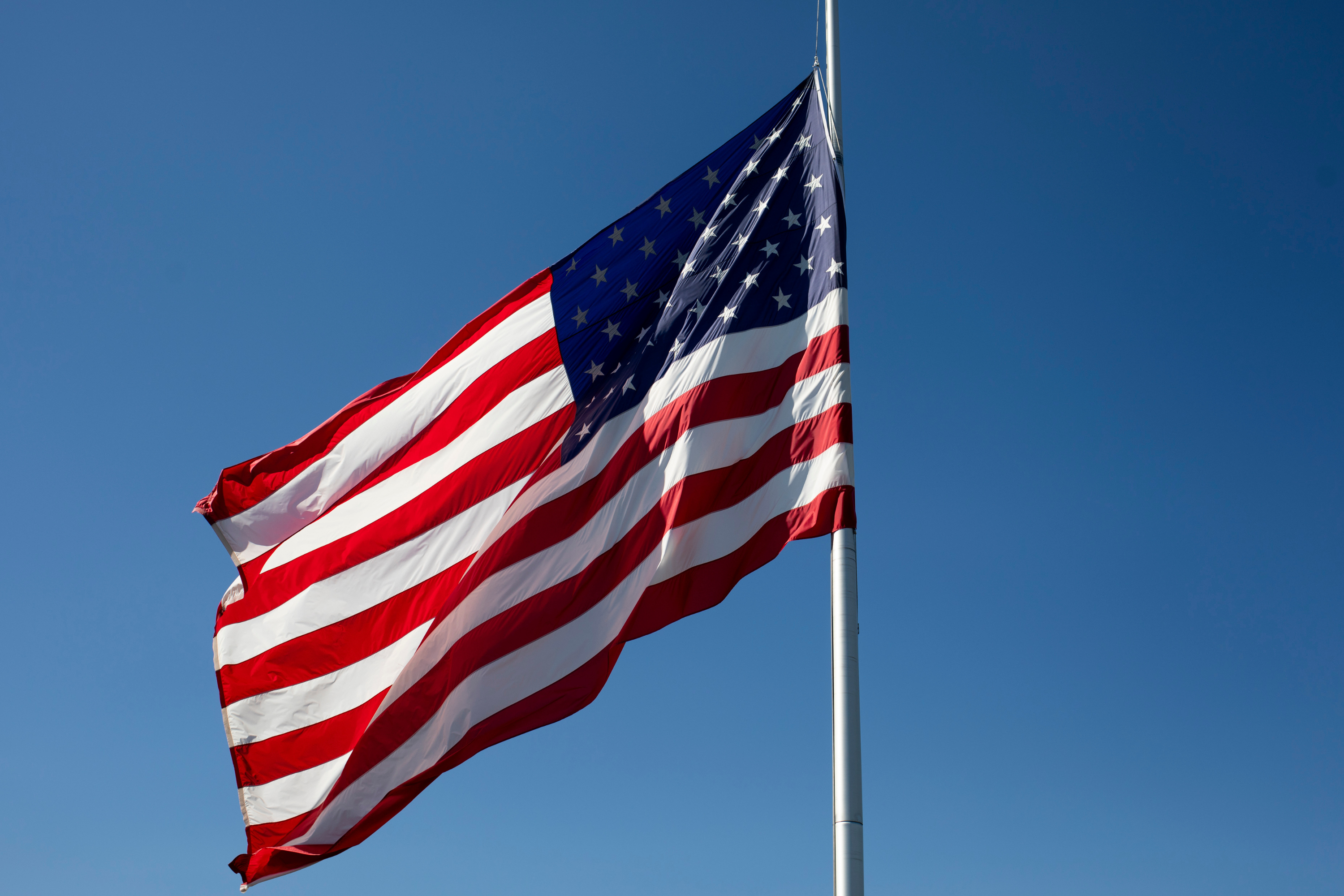 Why Flags Are Half-Staff in Six States Today, This Weekend