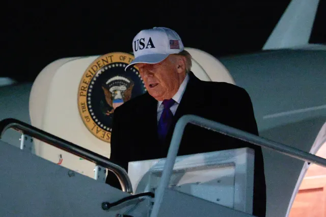 President Donald Trump steps off of Air Force One after returning to the nation's capital on February 19, 2026 at Joint Base Andrews, Maryland.