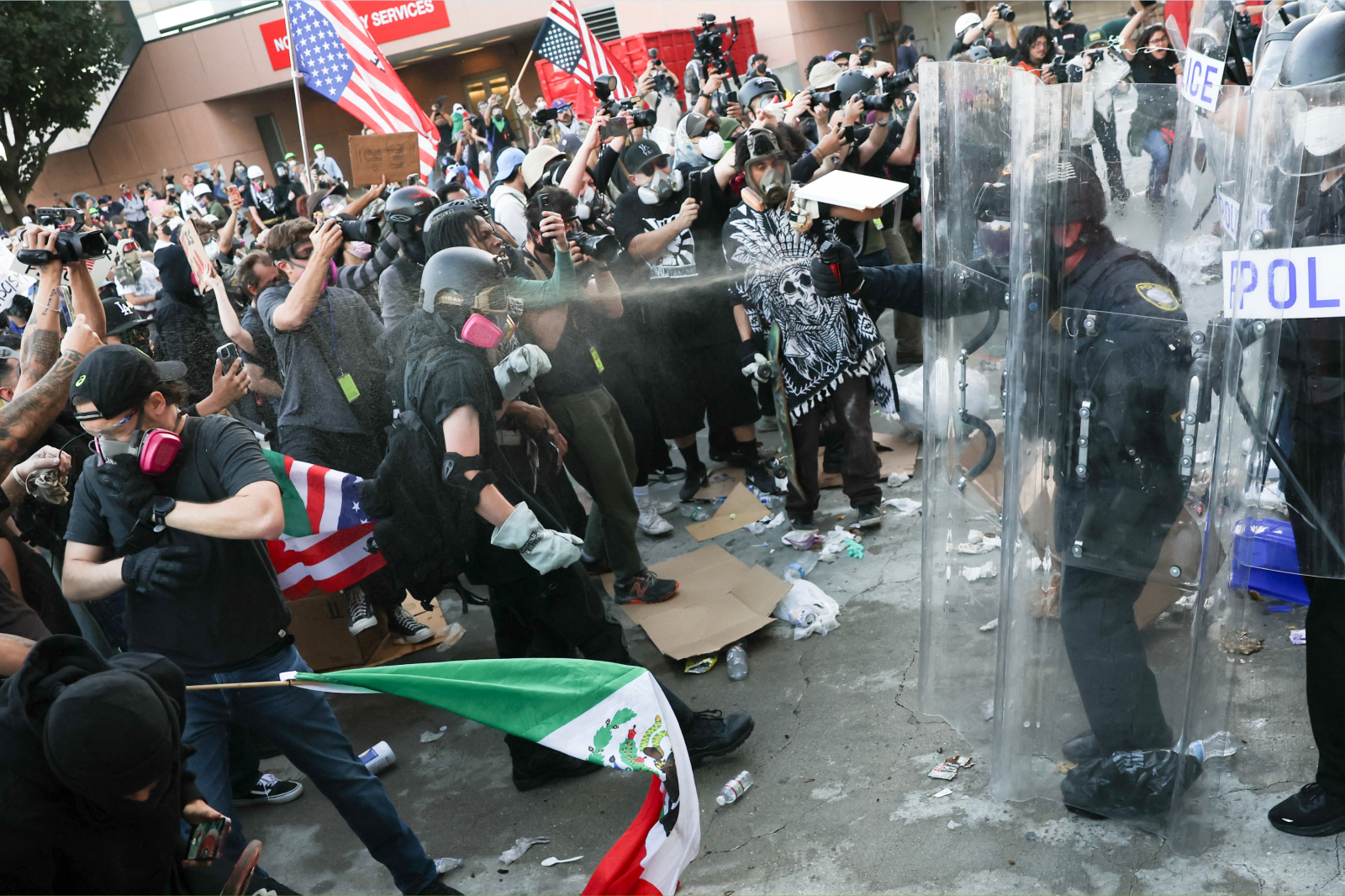A protestor is sprayed by a police officer during a “National Shutdown” protest against US Immigration and Customs Enforcement in Los Angeles on January 30, 2026.
