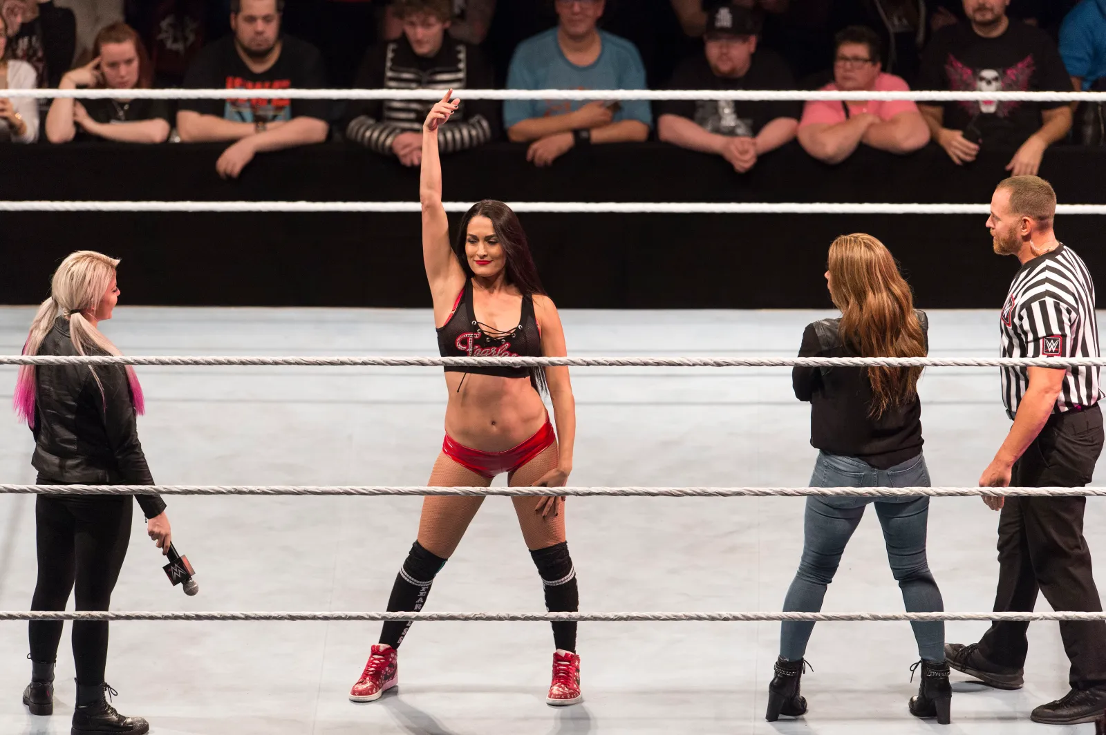 Nikki Bella in WWE ring with Alexa Bliss during live show in Germany