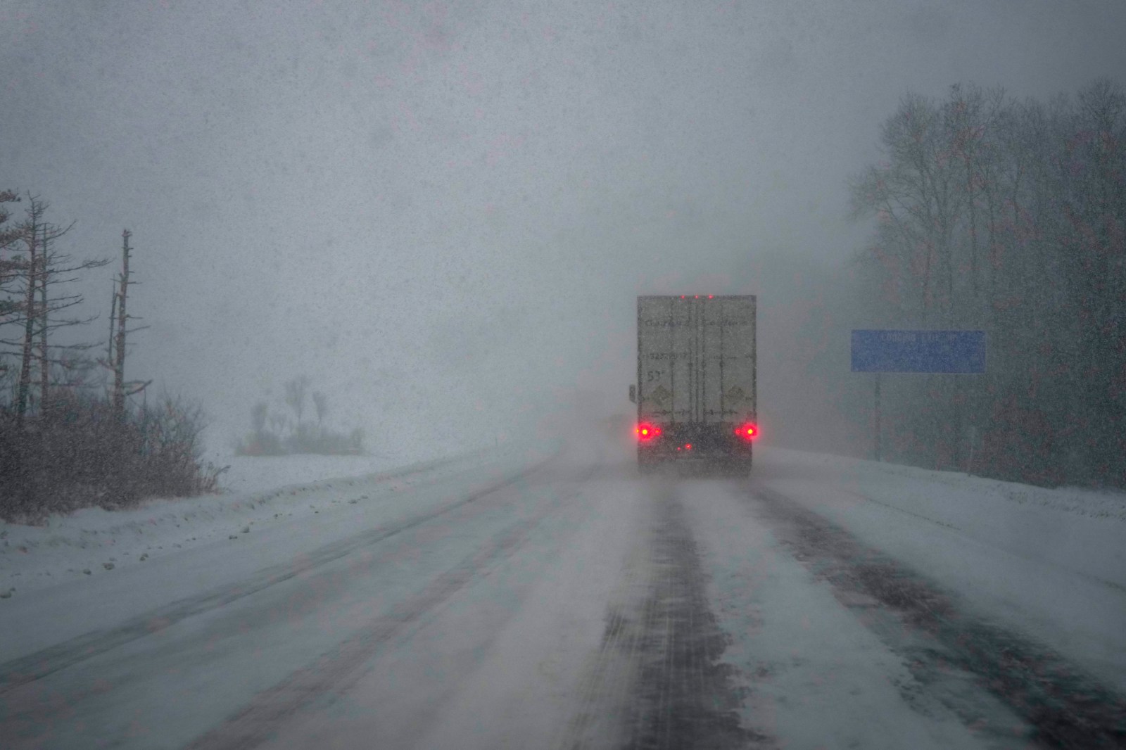 WATERTOWN, NEW YORK – DECEMBER 5: A semi-truck with hazard lights on navigates through the snow squall on I-81 on December 5, 2024 in Watertown, New York. This region in New York is experiencing the second snowstorm of the week and has been under a Winter Storm Warning for two days. (Photo by Kayla Bartkowski/Getty Images)
