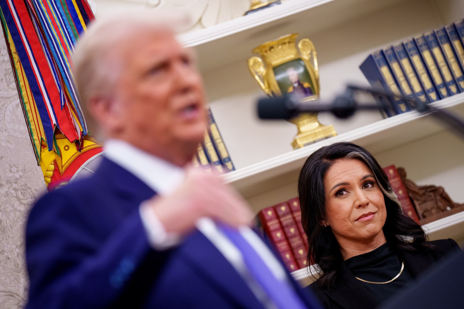 WASHINGTON, DC – FEBRUARY 12: U.S. President Donald Trump, accompanied by Tulsi Gabbard, speaks after Gabbard is sworn in as director of national intelligence in the Oval Office at the White House on February 12, 2025 in Washington, DC. Gabbard, who will oversee the 18 intelligence agencies and serve as Trump’s advisory on intelligence, was confirmed by the Senate 52-48. (Photo by Andrew Harnik/Getty Images)
