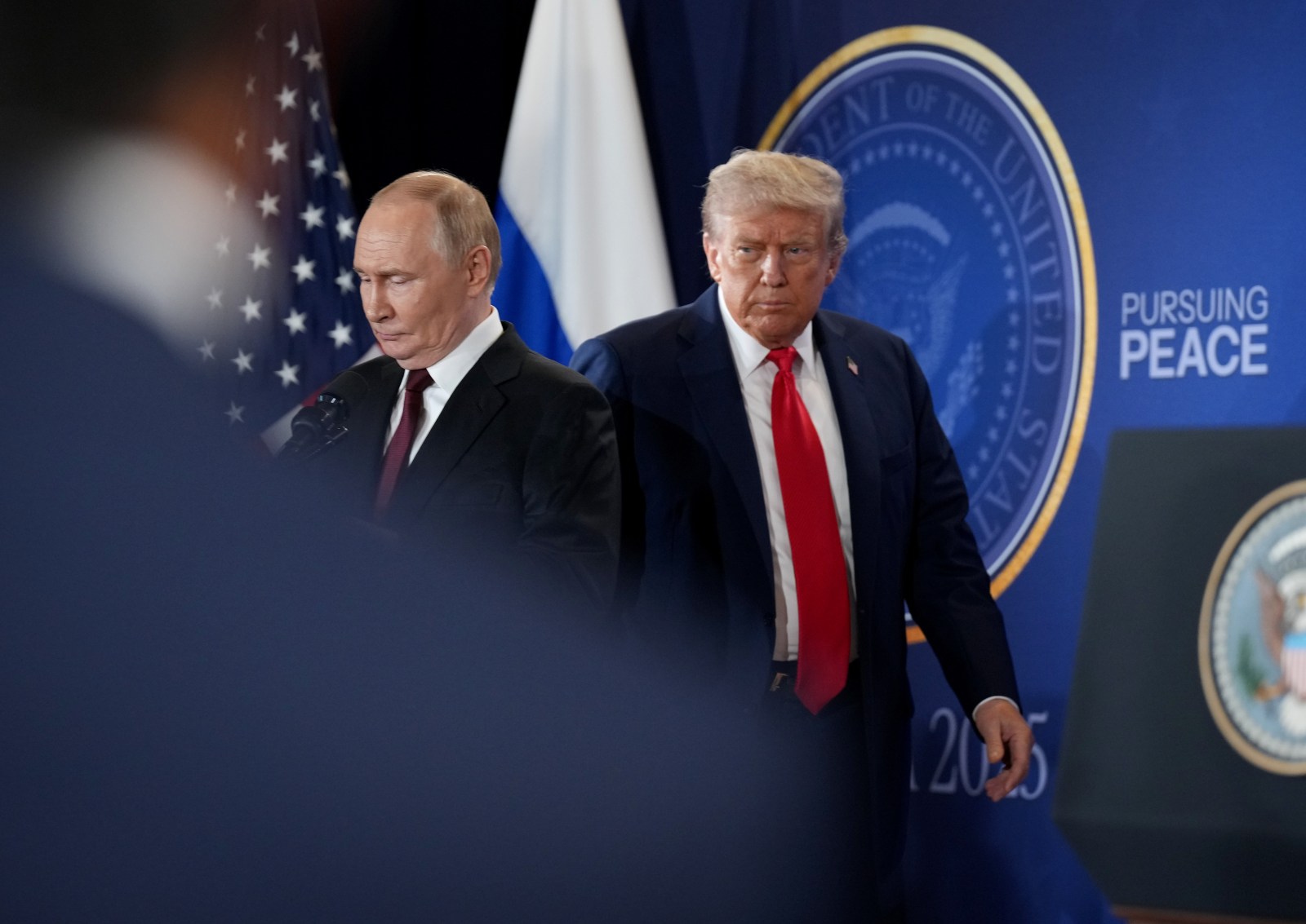 U.S. President Donald Trump (R) and Russian President Vladimir Putin arrive for a press conference at Joint Base Elmendorf-Richardson on August 15, 2025 in Anchorage, Alaska. 
