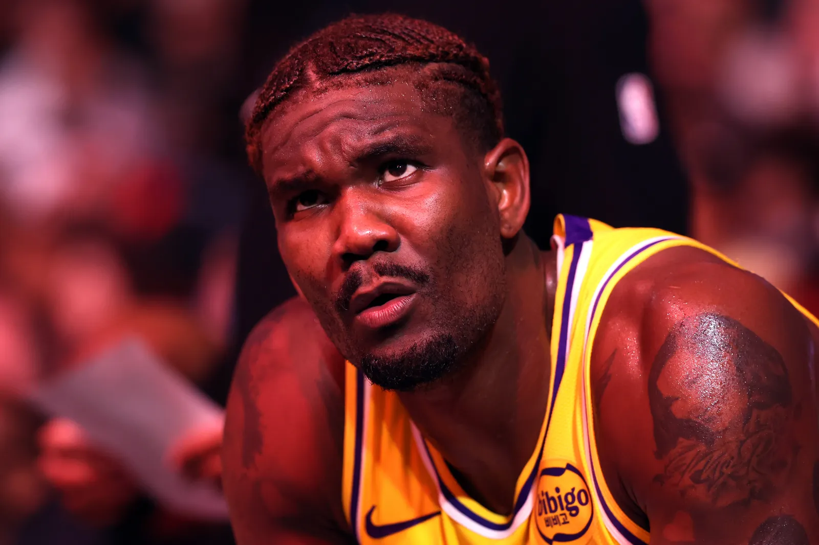 PHOENIX, ARIZONA - DECEMBER 23: Deandre Ayton #5 of the Los Angeles Lakers sits on the bench during a time out in the second half against the Phoenix Suns at Mortgage Matchup Center on December 23, 2025 in Phoenix, Arizona. The Suns defeated the Lakers 132-108. NOTE TO USER: User expressly acknowledges and agrees that, by downloading and or using this photograph, User is consenting to the terms and conditions of the Getty Images License Agreement.  (Photo by Chris Coduto/Getty Images)