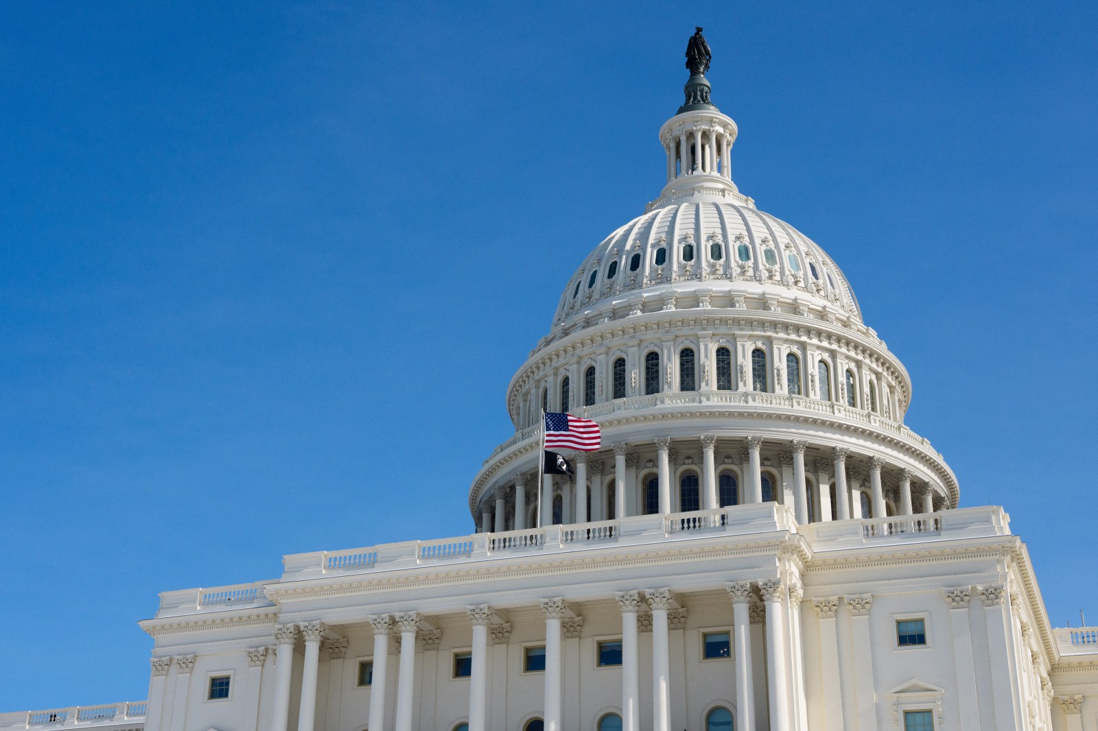 A US flag flies on the US Capitol in Washington, DC, on January 31, 2026.
