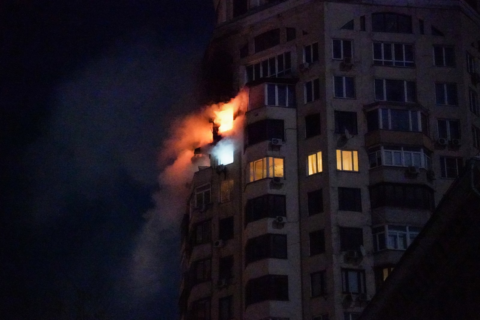 TOPSHOT – This photo shows fire coming from an apartment building following a Russian air attack in Kyiv early on February 3, 2026, amid the Russian invasion of Ukraine. Russia resumed strikes on Kyiv on February 3, Ukrainian officials said, as a week-long truce announced by US President Donald Trump gave way to renewed attacks in freezing conditions. (Photo by Serhii Okunev / AFP via Getty Images)

