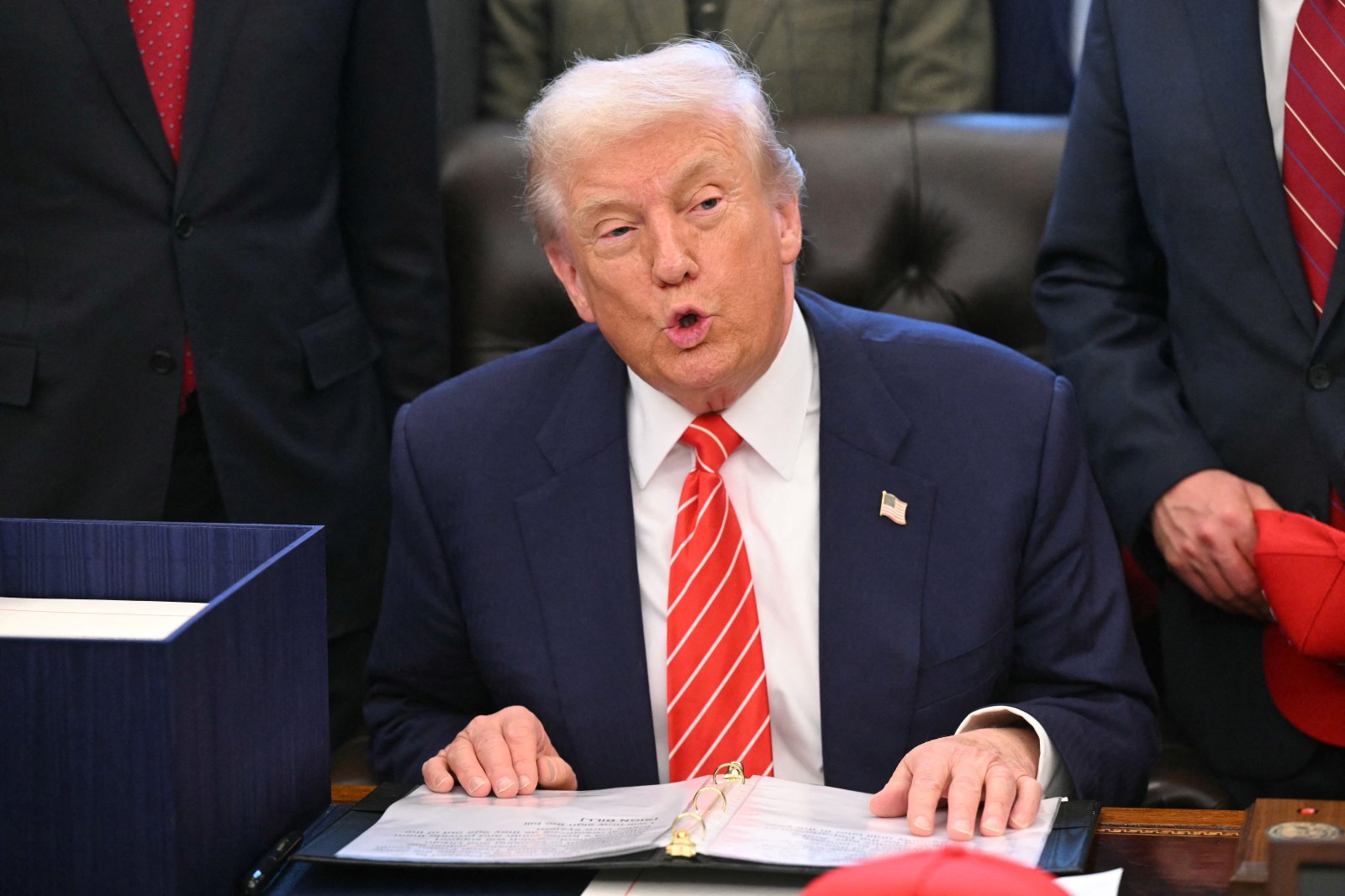 Donald Trump speaks to the press before signing a funding bill to end a partial government shutdown in the Oval Office of the White House in Washington, DC, on February 3, 2026. 
