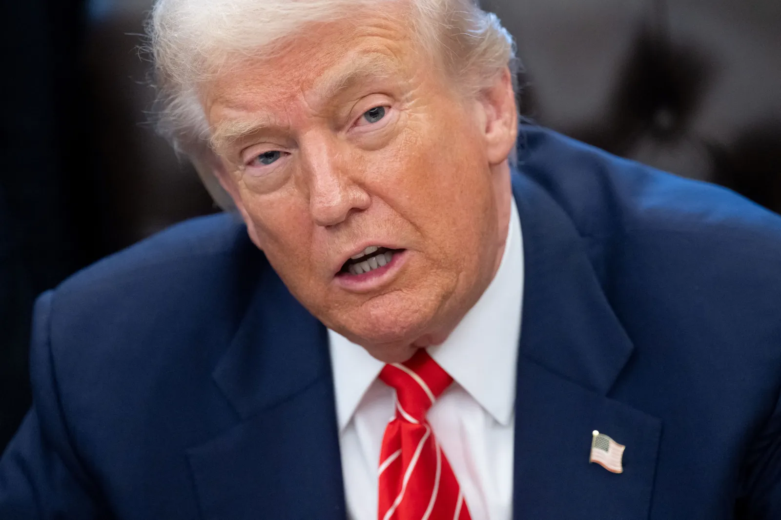 Donald Trump speaks with the media after signing a funding bill to end a partial government shutdown in the Oval Office of the White House in Washington, DC, February 3, 2026.